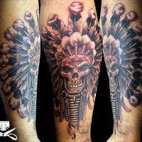 3D style natural looking colorful forearm tattoo of old Indian skull with helmet