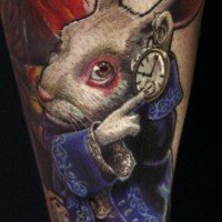 3D style painted and colored Alice in wonderland rabbit tattoo on forearm