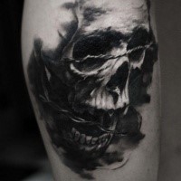 3D style very detailed arm tattoo of human skull with barbed wire