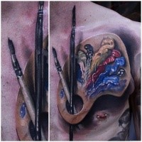 3D style very detailed chest tattoo of paint and brushes