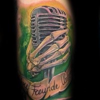 3D style very detailed tattoo of vintage microphone with skeleton hand and lettering