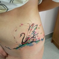 Abstract vivid-colored swan tattoo on side