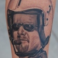 Accurate painted black ink pilot portrait tattoo on forearm