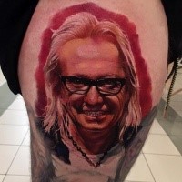 Accurate painted colored thigh tattoo of famous artist portrait