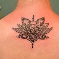 Amazing black-and-white tribal lotus flower tattoo on back