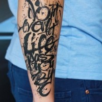 Amazing disorder-lettered black-ink quote tattoo for men on forearm