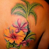 Amazing tropical flowers with palm tattoo on back