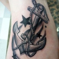 Anchor and stars traditional tattoo on foot