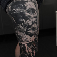 Ancient statue face tattoo on leg sleeve
