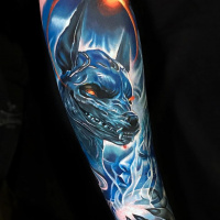 Anubis and space tattoo on arm