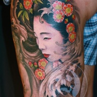 Asian style cute girl tattoo on leg