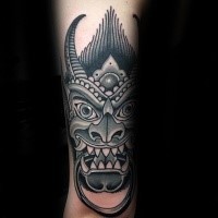 Asian traditional black ink arm tattoo of gargoyle head