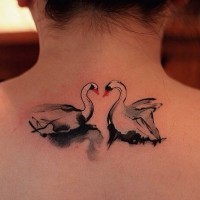 Attractive white swan couple tattoo on upper back