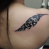 Awesome black-ink tribal feather tattoo on back
