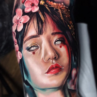 Awesome colorful Geisha portrait tattoo