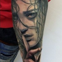 Awesome crying girl face tattoo on outer forearm