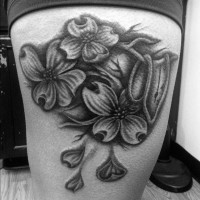 Awesome dark-colored flowers tattoo on thigh