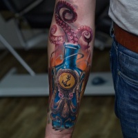Awesome octopus in bottle tattoo on forearm