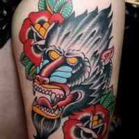 Awesome old school baboon with flowers tattoo on thigh