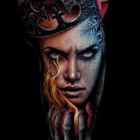 Awesome realistic face tattoo with hot and cold motives