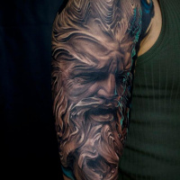 Awesome statue face tattoo on shoulder