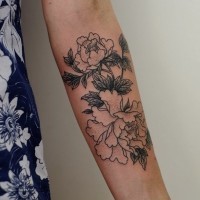 Beautiful black-and-white vintage rose flowers tattoo on arm