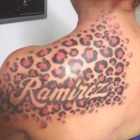 Beautiful color-ink cheetah print tattoo on shoulder