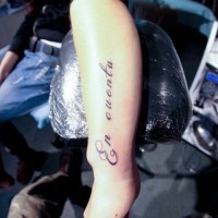 Beautiful en cuenta quote with curls tattoo on arm