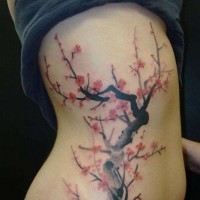Beautiful japanese sakura flower blossom tattoo on side