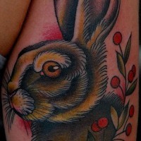 Beautiful old school hare with branch of berries tattoo on shin