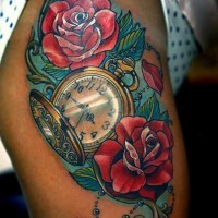 Beautiful red rose flowers and watch tattoo on thigh