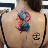 Beautiful watercolor hourglass tattoo on back