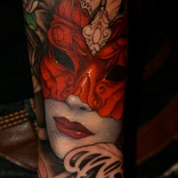 Beautiful woman in red mask tattoo