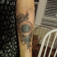 Beautiful womens black-and-white flower tattoo on forearm