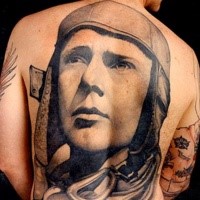 Big carelessly painted whole back tattoo of pilot portrait