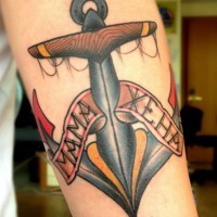 Big old school anchor with lettering tattoo on forearm