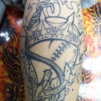 Black-and-white anchor piercing a heart with a crown on top tattoo on forearm