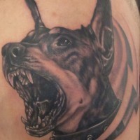 Black-and-white doberman with grin tattoo