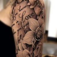 Black-and-white love quote with nice orchids tattoo for women on arm