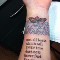 Black-lettered quote with paper bout on blue waves tattoo on arm