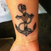 Black anchor with heart tattoo on wrist