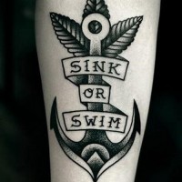 Black anchor with sink or swim lettering tattoo on forearm