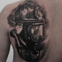 Black and white Firefighter tattoo on back