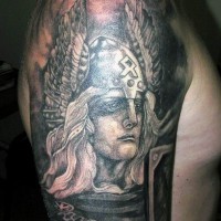 Black and white Viking warrior in winged helmet tattoo on shoulder