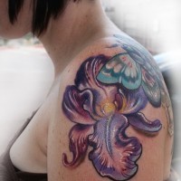 Chic colorful iris flower and butterfly tattoo on shoulder