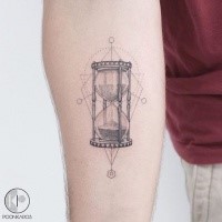 Clear lines hourglass forearm tattoo