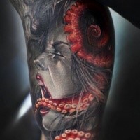 Colored modern style biceps tattoo of creamong woman with monster octopus