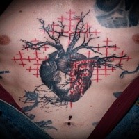 Colored trash polka style colored chest tattoo of heart with lettering