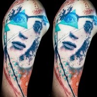 Colored trash polka style colored upper arm tattoo of woman with blue triangle