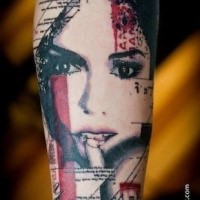 Colored trash polka style forearm tattoo of seductive woman with lettering